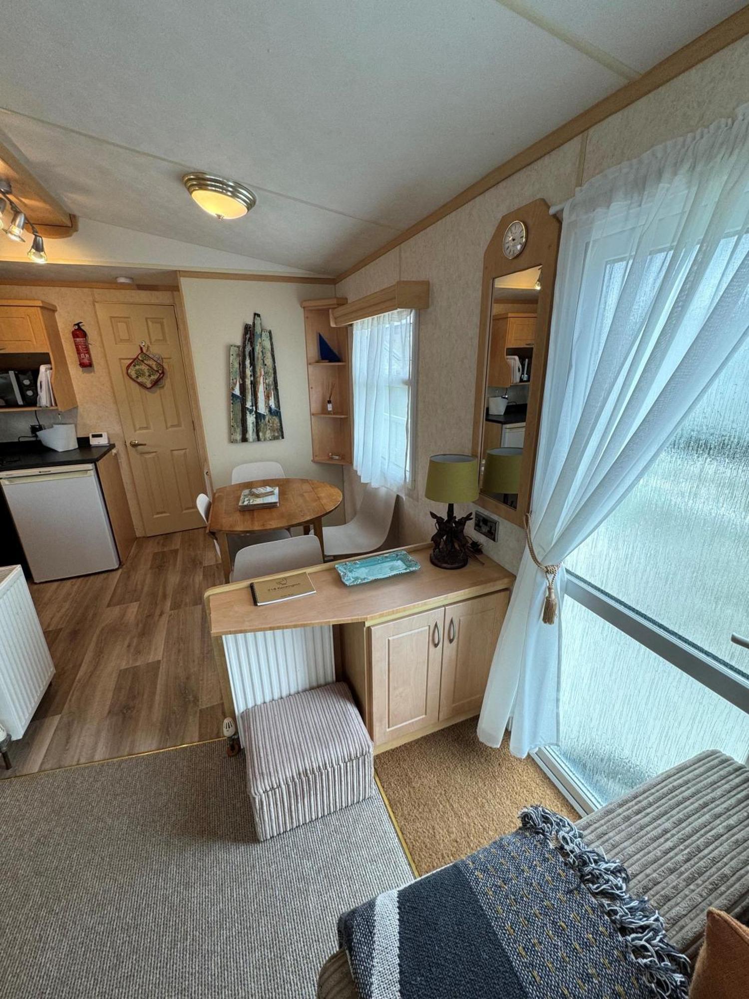 Lovely Caravan For Hire With Large Decking Area In Ref 23218k Campsite