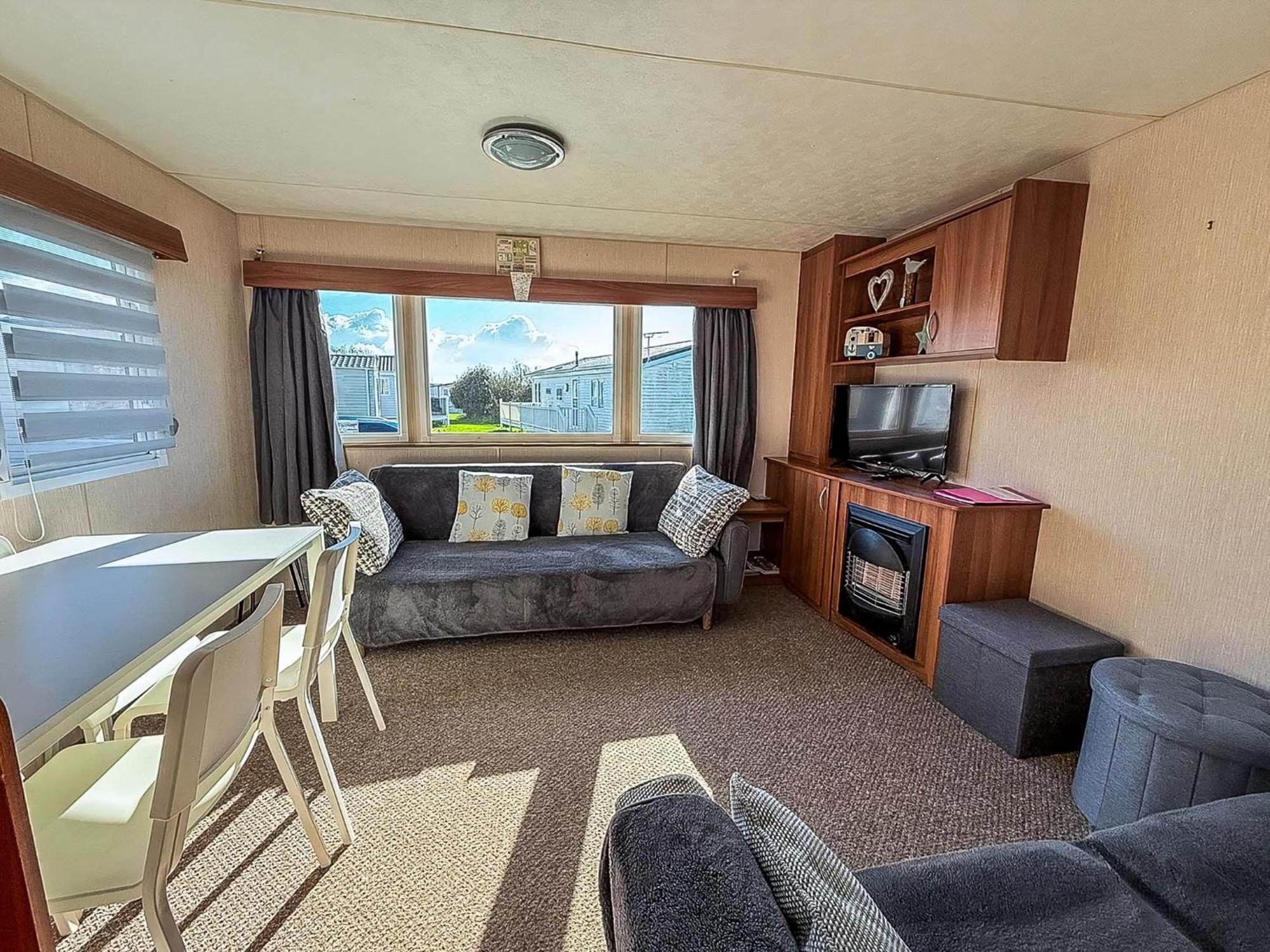 Beautiful 6 Berth Caravan For Hire With Huge Decking At Manor Park Ref 23142k Campsite