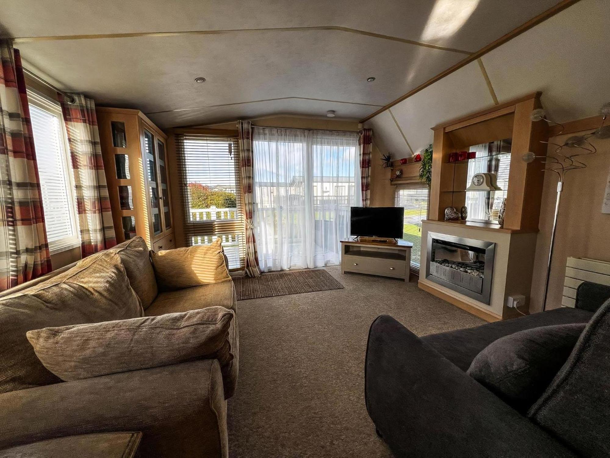 Great Caravan For Hire With Pond Views At Manor Park Holiday Park Ref 23228k Campsite